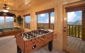 A foosball table and a pool table in a Smoky Mountain resort cabin.