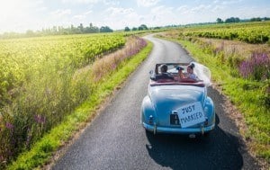 A bride and groom driving to our Smoky Mountain honeymoon cabin rentals.