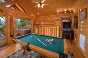 Game room with pool table and arcade game in Wears Valley cabin