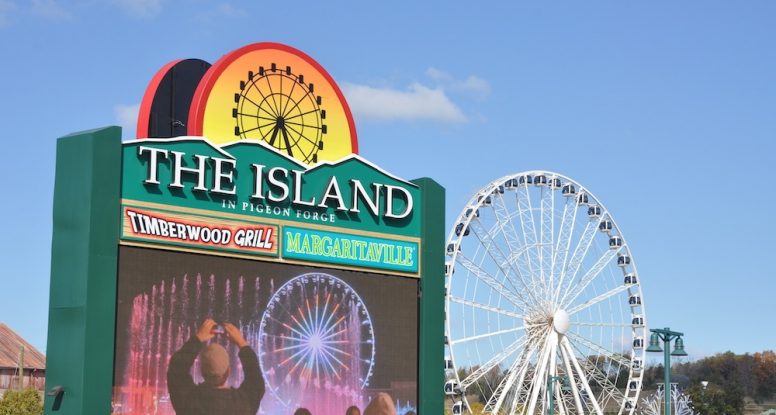 The Island sign with the Wheel in the background