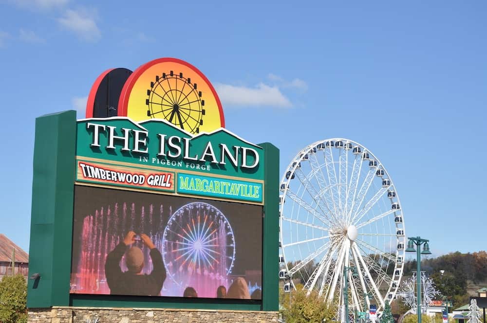 The Island sign with the Wheel in the background