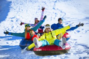 snow tubing with a group of friends