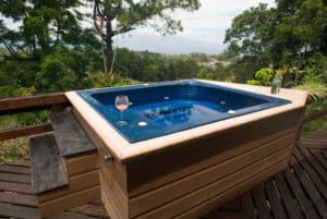 Hot tub with mountain view outside cabin